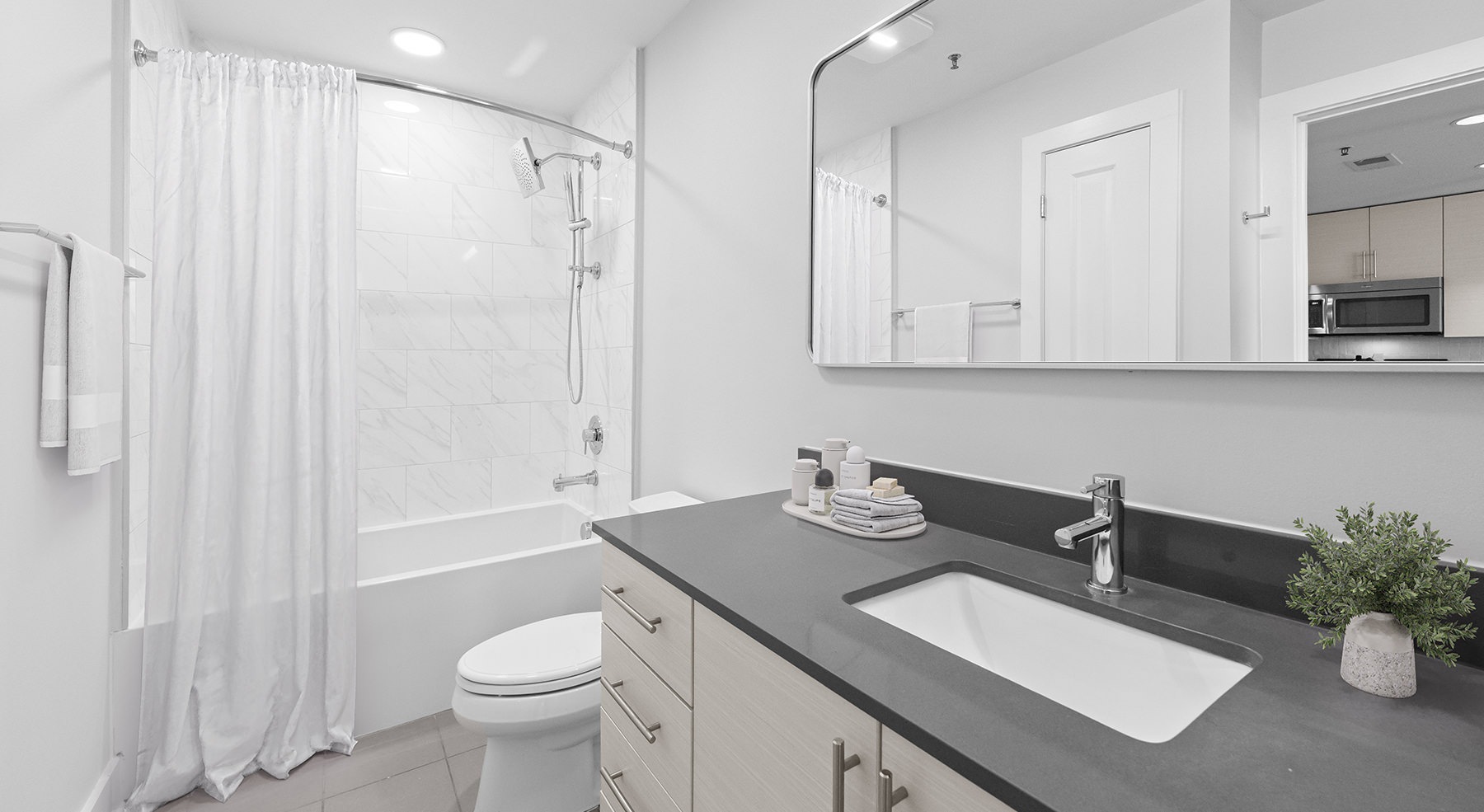 bath with sink and shower