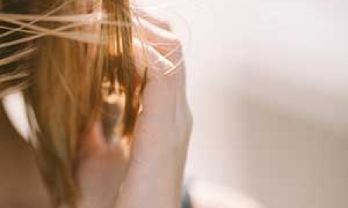 Lady with breeze blowing through a ladies hair