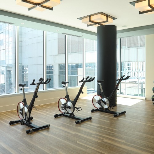 Spin bikes in well-lit fitness center